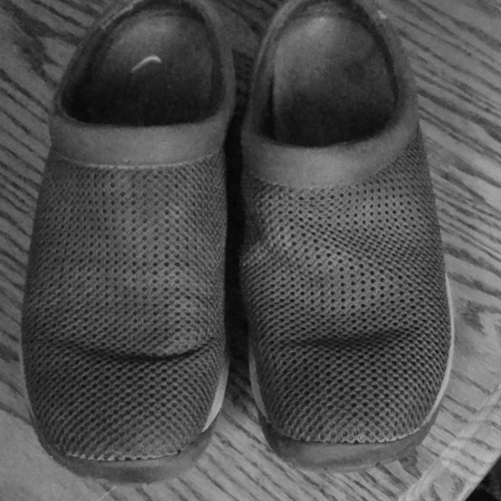 Black slip on shoes.